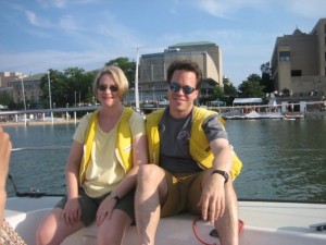 Bill and Allison get comfortable while sailing in front of the Memorial Union Terrace.