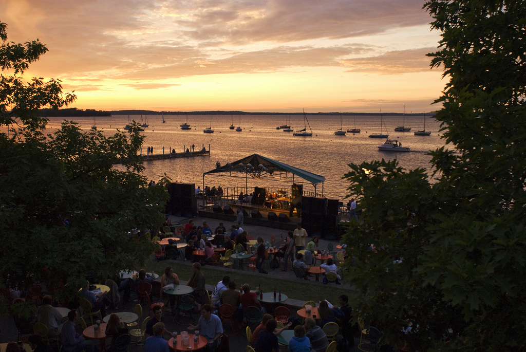 As a fiery sunset falls over Lake Mendota and the band shelter at the Memorial Union Terrace at the University of Wisconsin-Madison, musicians prepare to play a show during the Union's Hot Summer Nights music series on June 22, 2007. ©UW-Madison University Communications 608/262-0067 Photo by: Jeff Miller Date:  06/07    File#:   D200 digital camera frame 1200