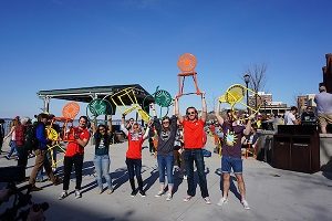 WUD Executive Members holding up Terrace chairs