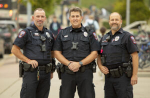 Officer Barrett Erwin standing with a group of UWPD officers